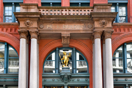 New York City - August 17, 2019: Historic Puck Building with gilded statue of Shakespeare's character Puck.のeditorial素材