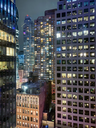 New York cityscape at night up close of towering building.の写真素材