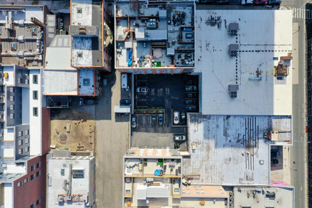 Top down aerial view of buildings and a parking lot in Williamsburg, Brooklyn, New York.