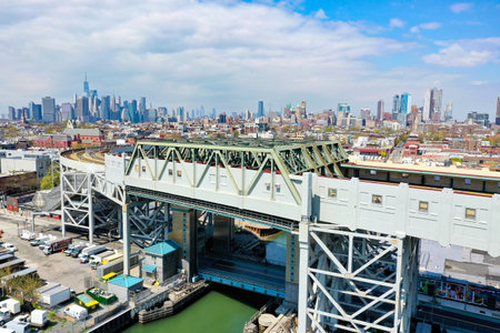 Panoramic view of the Gowanus Canal in Brooklyn with the Gowanus Expressway and Manhattan in the...