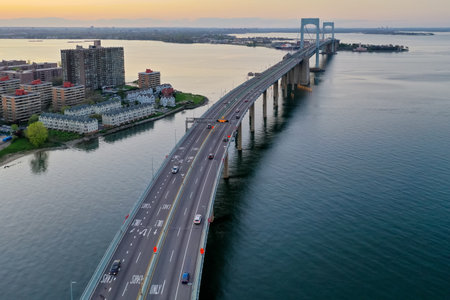 Aerial view of the Throgs Neck Bridge connecting the Bronx with Queens in New York City at sunset.のeditorial素材
