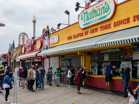 New York City - May 25, 2020: Nathan's Restaurant on the Coney Island Boardwalk with social distancing on Memorial Day 2020.のeditorial素材