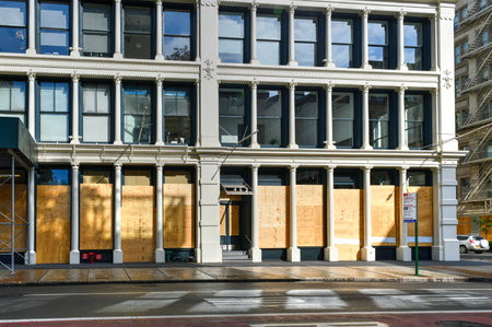 New York City, New York - June 11, 2020: Store closed during the COVID-19 pandemic, with boarded up...