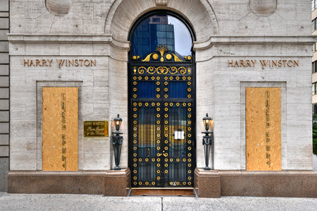 New York City, New York - June 11, 2020: Store closed during the COVID-19 pandemic, with boarded up windows to protect against looting as a result of anti-police brutality protests.のeditorial素材