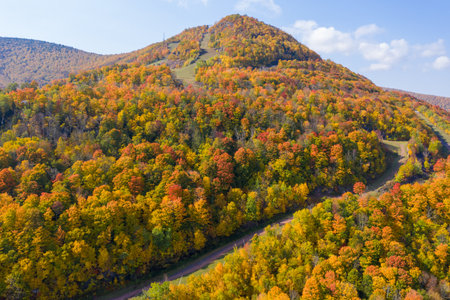 Colorful Hunter Ski Mountain in upstate New York during peak fall foliage.の写真素材