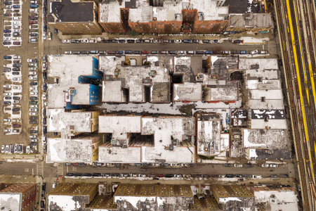 Aerial view of a snow covered roofs of buildings in Brighton Beach during the winter in Brooklyn,...