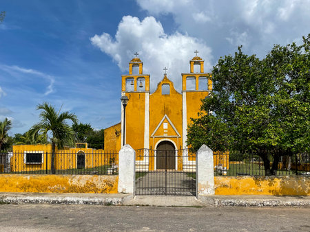 Yellow church in the small village of Xanaba, This church is typical of the small colorful churches that can be found in Yucatan, Mexico.の写真素材