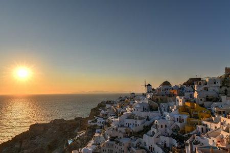 Classic Oia, Santorini skyline at sunset with buildings in Greece.の写真素材