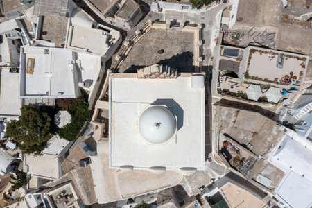 Orthodox Church with its multitiered bell tower facade in Emporio, Santorini, Greece.の写真素材