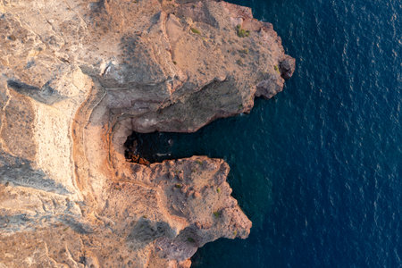 Aerial view of the coast of Santorini, Greece from Akrotiri at sunset.の写真素材