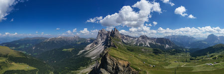 Morning view of the Gardena valley in Dolomite mountains. Location Puez-Geisler National Park, Seceda peak, Italy, Europe. Odle group is the landmark of Val di Funes.の写真素材