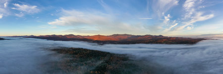 Panoramic view of peak fall foliage in Stowe, Vermont.