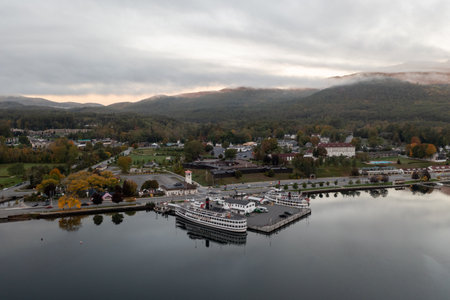 Lake George, New York - October 10, 2021: Tourist boats in the bay in Lake George, New York at dawn.のeditorial素材