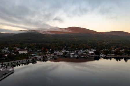 Lake George, New York - October 10, 2021: Tourist boats in the bay in Lake George, New York at dawn.のeditorial素材