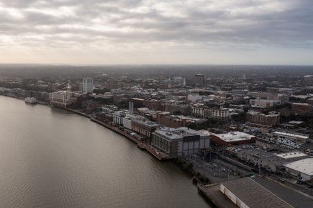Aerial view of the Savannah city skyline on a sunny day. View along the Savannah River between...