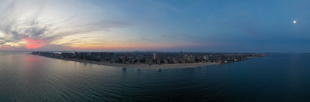 Aerial view of Brighton Beach and Coney Island with Manhattan in the background at sunset.の写真素材