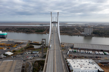 Aerial view of Talmadge Memorial Bridge on a sunny day. The Talmadge Memorial Bridge is a bridge spanning the Savannah River between downtown Savannah, Georgia, and Hutchinson Island.のeditorial素材
