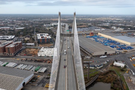 Aerial view of Talmadge Memorial Bridge on a sunny day. The Talmadge Memorial Bridge is a bridge spanning the Savannah River between downtown Savannah, Georgia, and Hutchinson Island.のeditorial素材