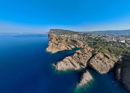 Aerial view of Calanque de Figuerolles, a snug cove framed by rugged cliffs in France.の写真素材