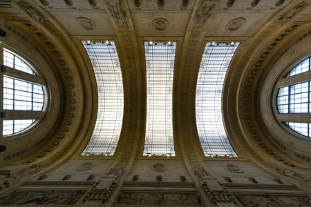 Milan, Italy - Aug 2, 2022: Interior view of busy Central Station main hall in Milan, Italyの写真素材