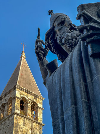 Monumental bronze statue of Bishop Gregory of Nin created in 1929 by Ivan Mestrovic and Saint Rainier Benedict monastery belfryの写真素材