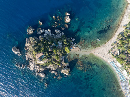 Aerial view of the beach and island Isola Bella at Taormina, Sicilyの写真素材