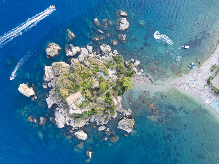 Aerial view of the beach and island Isola Bella at Taormina, Sicilyの写真素材