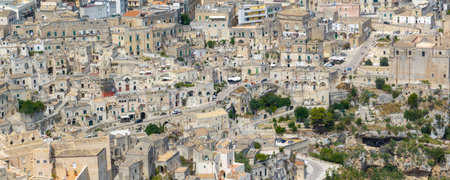 Aerial view of the ancient town of Matera (Sassi di Matera) in beautiful Basilicata, southern Italy. ancient cave houses carved into the tufa rock over the deep ravine, Gravina River.の写真素材