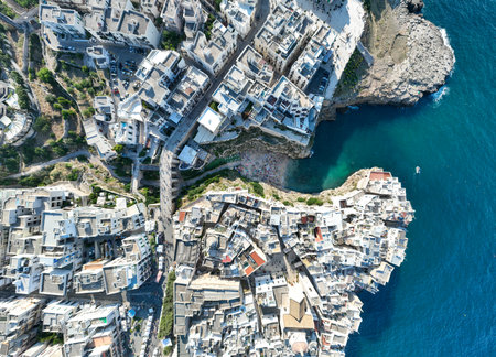 Polignano a Mare drone shot. Aerial view shot of Cala Paura in Puglia, Polignano. Most famous beach in South Italy.の写真素材