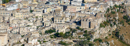Aerial view of the ancient town of Matera (Sassi di Matera) in beautiful Basilicata, southern Italy. ancient cave houses carved into the tufa rock over the deep ravine, Gravina River.の写真素材