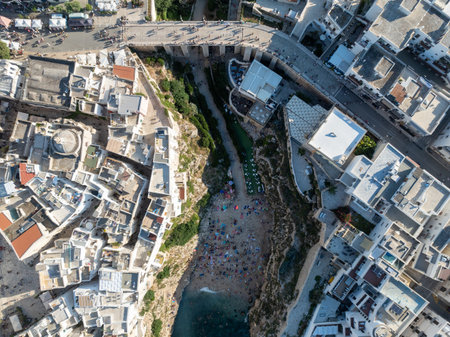 Polignano a Mare drone shot. Aerial view shot of Cala Paura in Puglia, Polignano. Most famous beach in South Italy.の写真素材