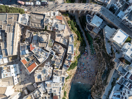 Polignano a Mare drone shot. Aerial view shot of Cala Paura in Puglia, Polignano. Most famous beach in South Italy.の写真素材