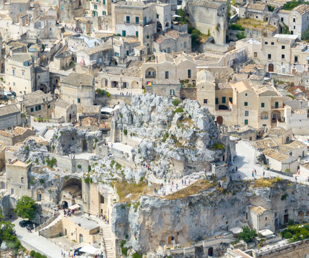 Aerial view of the ancient town of Matera (Sassi di Matera) in beautiful Basilicata, southern Italy. ancient cave houses carved into the tufa rock over the deep ravine, Gravina River.の写真素材