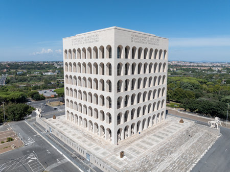 Palazzo della Civilta  Italiana (Palace of Italian Civilization) in EUR, Rome, Italy. Inscription "A people of poets, artists, heroes, saints, thinkers, scientists, navigators, transmigrants".の写真素材