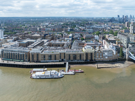 London, UK - June 23, 2024: View of Butler's Wharf from across the River Thames in London, England.の写真素材