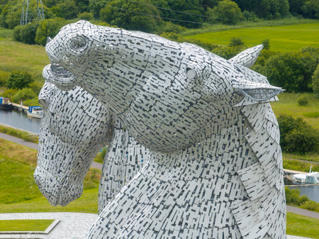 The Kelpies are a pair of monumental steel horse-heads between the Scottish towns of Falkirk and Grangemouth.の写真素材