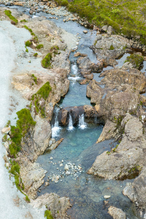 Ethereal Beauty of Fairy Pools Under the Majestic Skye Mountains of Scotland.