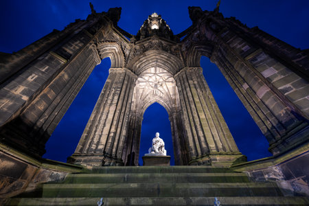 Edinburgh, UK - Jul 17, 2024: Scott Monument in Edinburgh, Scotland, United Kingdom at night. Built in honor of Sir Walter Scott.の写真素材