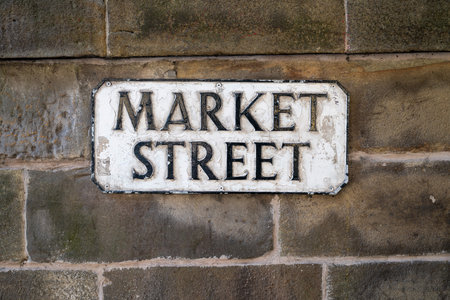 Market Street sign in Edinburgh, Scotland, United Kingdom against a wall.の写真素材