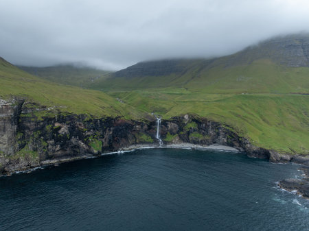 Skarosafossur Waterfall on the island of Vagar in the Faroe Islands.の写真素材