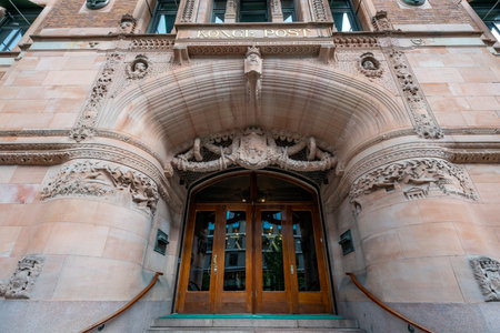 Beautiful ornate main entrance to a colorful historical building made of pink marble. Vasagatan street in Stockholm, Sweden.の写真素材