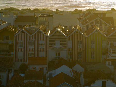 Colorful striped houses called Palheiros with red, blue and green stripes. Costa Nova do Prado is a beach village resort on Atlantic coast near Aveiro.の写真素材