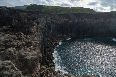 Volcanic lava-formed coastal cliffs at Alagoa Viewpoint, northern coast of Terceira, Azores.の写真素材