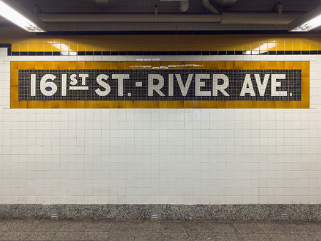 Bronx, New York - Sep 24, 2024: 161st Street River Avenue subway sign leading to Yankee Stadium in New York City.の写真素材