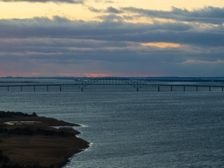 Aerial view of the Fire Island Inlet Bridge, an integral part of the Robert Moses Causeway, is a two-lane, steel arch span with a concrete deck that carries the parkway over Fire Island Inlet.の写真素材