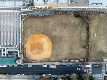Drone Aerial View flying above a poorly maintained outdoor Baseball Field Diamond.の写真素材