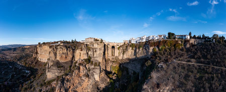 Rocky landscape of Ronda city with Puente Nuevo Bridge and buildings, Andalusia, Spainの写真素材