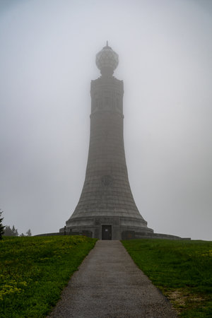 Adams, Massachusetts - May 24, 2025: The Veterans War Memorial Tower sits at the summit of Mount Greylock, the highest peak in the state of Massachusetts.の写真素材