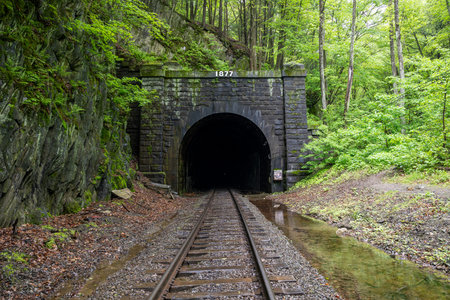 East Portal of the historic Hoosac Tunnel near North Adams, MAâan iconic 19th-century railroad tunnel framed by rugged stone and forested Berkshire scenery.の写真素材