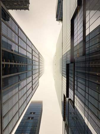 Vertical view of the skyscrapers in New York City on a cloudy day.